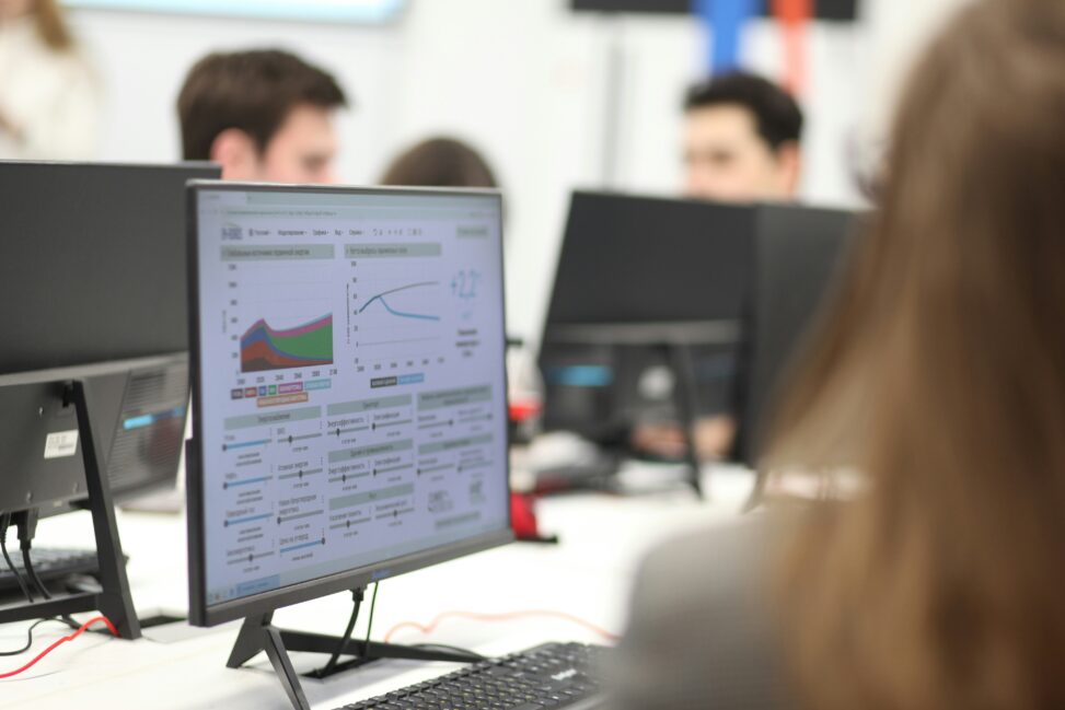 A computer screen displaying data charts and graphs, representing data analysis work.